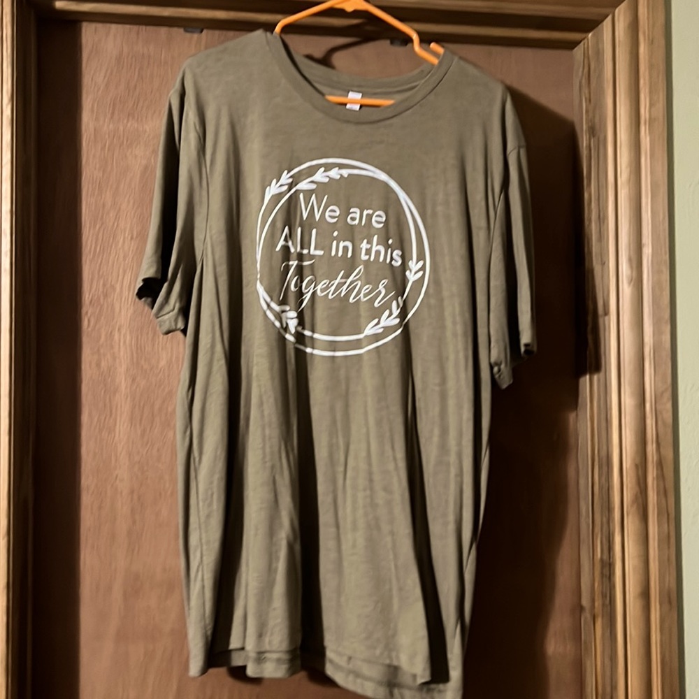 Olive green/tan graphic tee.